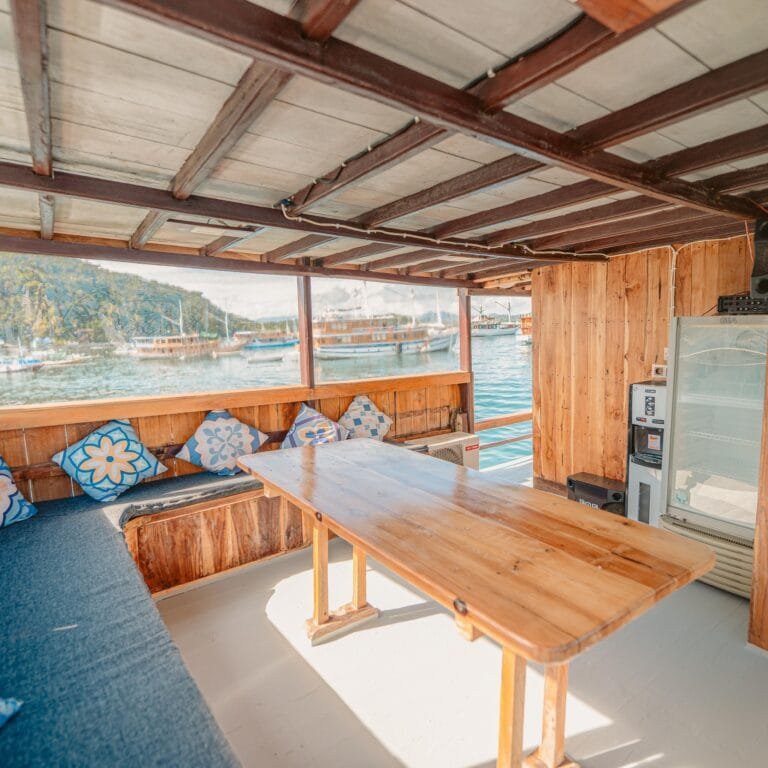 a table and chairs on a boat